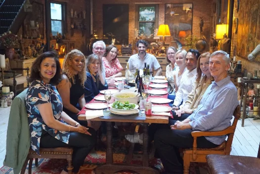 Guests gathered around the table at the Influencers Dinner